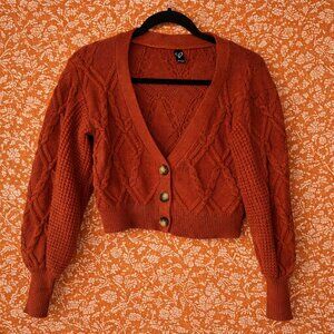 Cropped Rust Cardigan with Oversized Sleeves and Cable Knit Detail